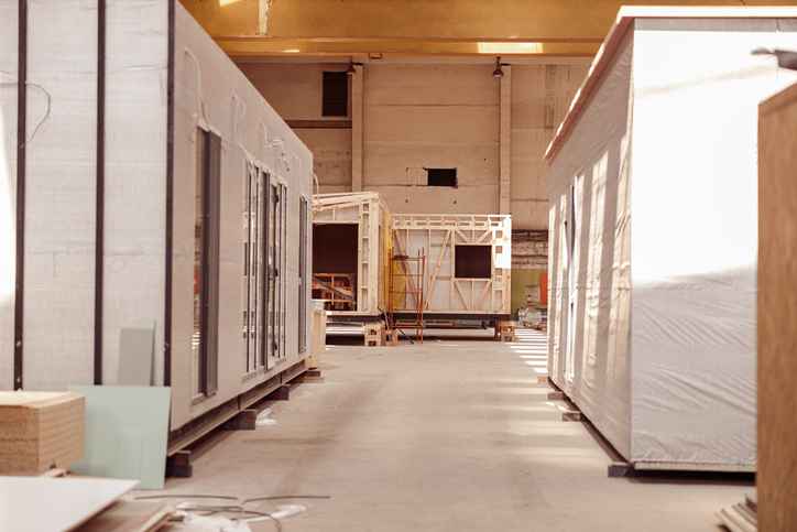 Manufactured homes being built in a factory
